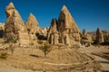 Spectacular unique volcanic rock formations at love valley. Beautiful landscape with mountains in summer in Sunny weather.