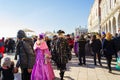 Spectacular Venice Masquerade celebration costumes and crowd of tourists Italy