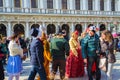 Spectacular Venice Masquerade characters costumes and crowd of tourists Italy