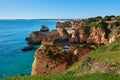 Spectacular view of Alvor village and colorful limestone rocks. Trekking route from Portimao to Alvor, Portugal Royalty Free Stock Photo