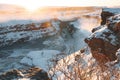 spectacular view of beautiful Gullfoss waterfall and snow-covered rocks