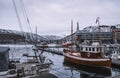 Spectacular view of boats and houses in the port of Tromso in winter, Norway.