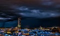 Spectacular view of Historic Triana Neighborhood and Seville city skyline a stormy night. Seville city, Tradition and Modernity Royalty Free Stock Photo