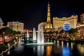 A spectacular view of the Las Vegas strip at night with the iconic Eiffel Tower standing tall in the background, View of the