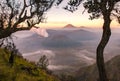 Spectacular view of Mount Bromo at dawn view look through the natural frame. Royalty Free Stock Photo