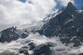 Spectacular view of a snow covered mountain range under the beautiful sunny sky.