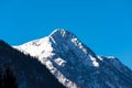 Spectacular view of the snowcapped Dachstein summit against beautiful blue sky. Royalty Free Stock Photo