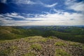 Spectacular view from the top of the mountain to the mountain slopes and meadows Royalty Free Stock Photo