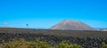 Panoramic view of mountain range with volcanoes in Timanfaya National Park. Cloudless blue sky. Lanzarote, Canary Islands Royalty Free Stock Photo