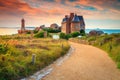 Spectacular walkway and lighthouse in Brittany region, Ploumanach, France, Europe Royalty Free Stock Photo