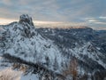 Spectacular winter mountain landscape illuminated by setting sun.