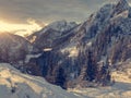 Spectacular winter mountain landscape illuminated by setting sun.