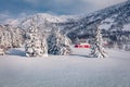 Spectacular winter view of Vestvagoy island with typical norwegian red wooden houses.