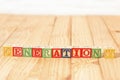 Spectacular wooden cubes with the word GENERATION Y on a wooden surface