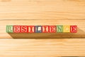 Spectacular wooden cubes with the word RESILIENCE on a wooden surface Royalty Free Stock Photo