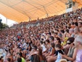 Spectators at arena having fun watching the show