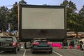 Spectators for car parking with cars, an inflatable screen of th