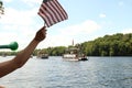 Spectators cheer riverside pontoon parade in Eau Claire Wisconsin Royalty Free Stock Photo