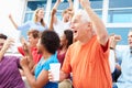 Spectators Cheering At Outdoor Sports Event Royalty Free Stock Photo