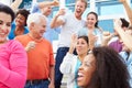 Spectators Cheering At Outdoor Sports Event Royalty Free Stock Photo