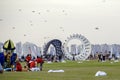 Spectators enjoy the large kites flying at Mina district in Qatar as part of Kite Festival 2024 Royalty Free Stock Photo