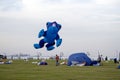 Spectators enjoy the large kites flying at Mina district in Qatar as part of Kite Festival 2024 Royalty Free Stock Photo