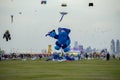 Spectators enjoy the large kites flying at Mina district in Qatar as part of Kite Festival 2024 Royalty Free Stock Photo