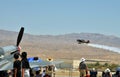 Spectators Watching Stearman Biplane Taking Off Royalty Free Stock Photo