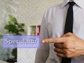 Speculator phrase on the piece of paper Royalty Free Stock Photo