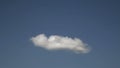 Sped Up White Puffy Cloud Changing Shape In Blue Sky