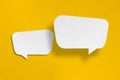 Speech balloon shape white paper isolated on yellow background