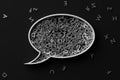 Speech bubble balloon shape filled with metal alphabetic character letters on dark background, literature, education, know-how or