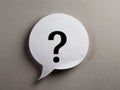 Speech bubble with question mark on grey background Royalty Free Stock Photo