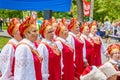 Speech by the folk choir and children-spoonboys at the press festival in Gagarin`s Park on a spring sunny day