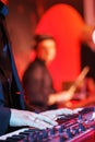 Speech by musicians on stage. Hands and musical instrument closeup.