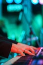 Speech by musicians on stage. Hands and musical instrument closeup.