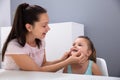 Speech Therapist Helps The Girl To Pronounce The Sounds Royalty Free Stock Photo