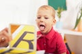 Speech therapist teaches the boys to say the letter R Royalty Free Stock Photo