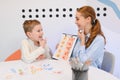 Speech therapist working with boy during speech therapy session Royalty Free Stock Photo