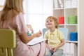 Speech therapist working with child boy in office Royalty Free Stock Photo