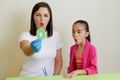 Speech therapist working with girl training pronunciation Royalty Free Stock Photo