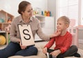 Speech therapist working with little boy Royalty Free Stock Photo