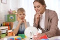 Speech therapist working with little boy Royalty Free Stock Photo