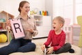 Speech therapist working with little boy Royalty Free Stock Photo