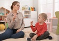 Speech therapist working with little boy Royalty Free Stock Photo