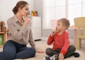 Speech therapist working with little boy Royalty Free Stock Photo