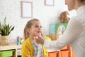 Speech therapist working with little girl Royalty Free Stock Photo