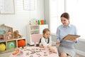 Speech therapist working with little girl Royalty Free Stock Photo