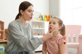 Speech therapist working with little girl Royalty Free Stock Photo