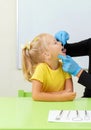 Speech therapist working with little girl in office training pronunciation Royalty Free Stock Photo